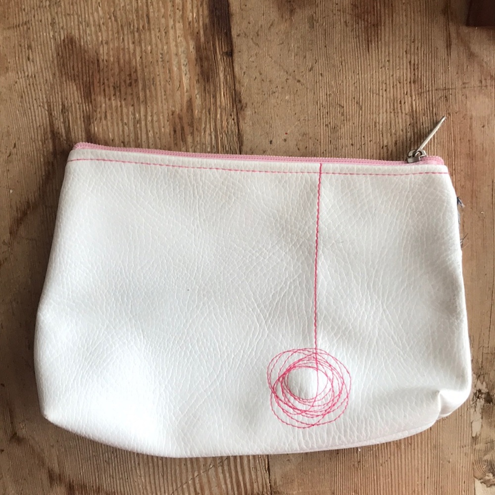white leather clutch handbag